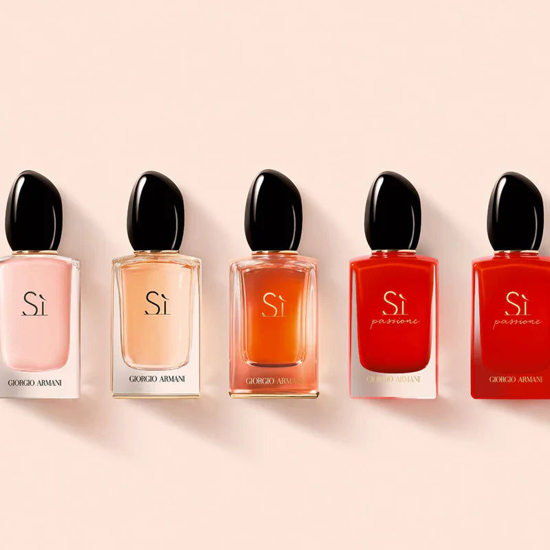 Five Giorgio Armani Si perfumes in different colors on a beige background